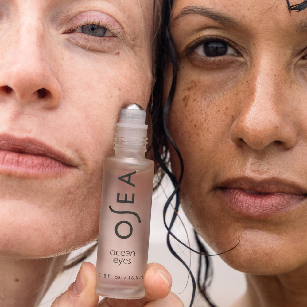 OSEA Ocean Eyes size comparison in hand illustrating compact travel-friendly design