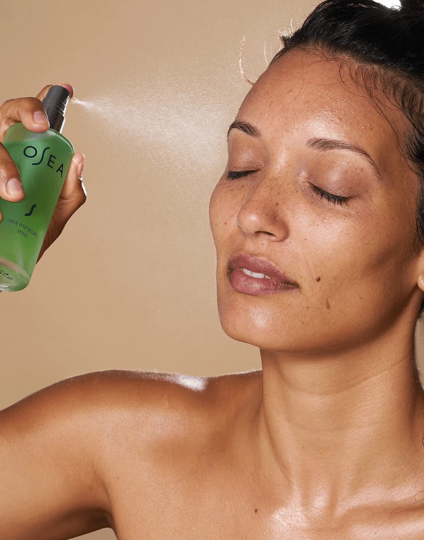 OSEA facial mist used at the beach providing cooling relief benefit