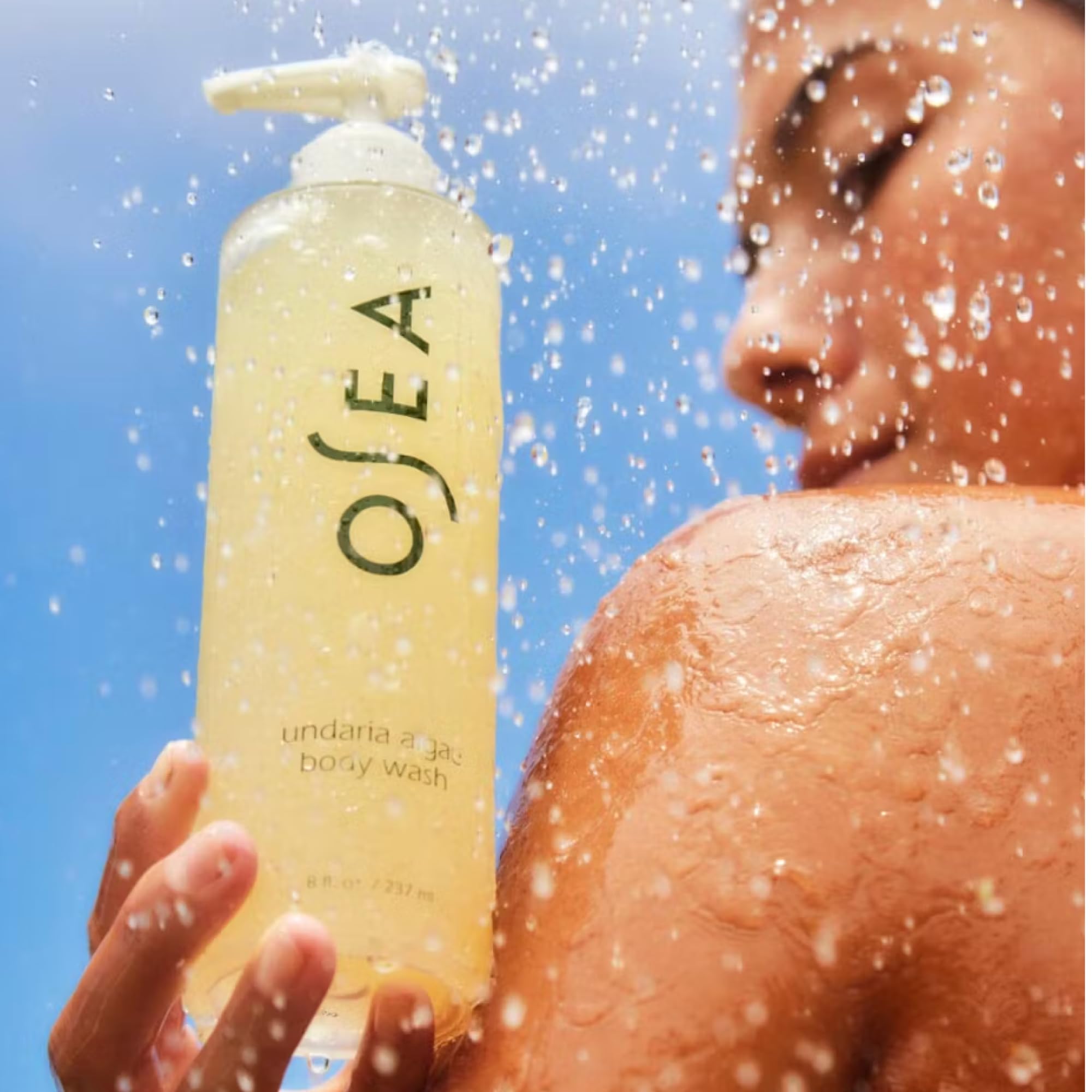 OSEA 8oz bottle next to common item to show compact travel-friendly size