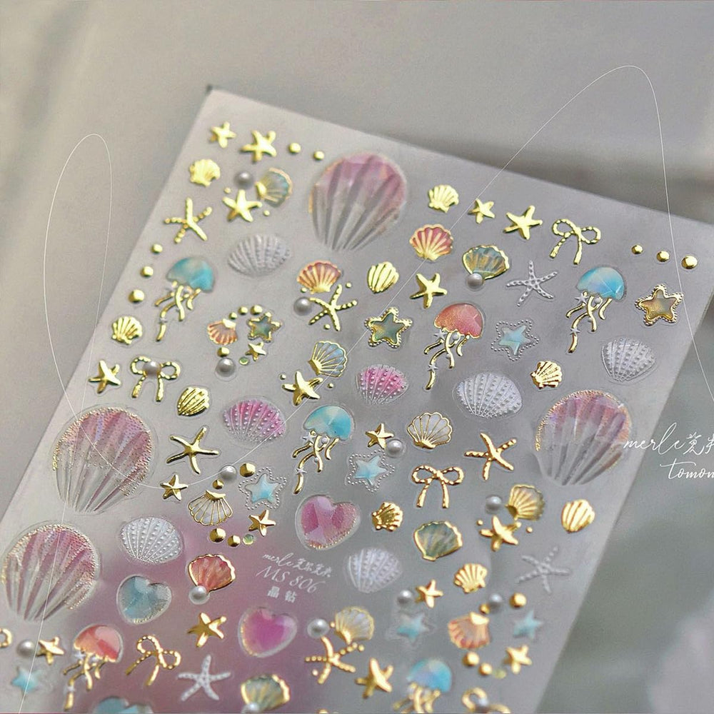 OSTTMA metallic gold and silver accents adding shiny highlights to nails