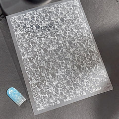 OSTTMA sticker on acrylic nails demonstrating professional finish