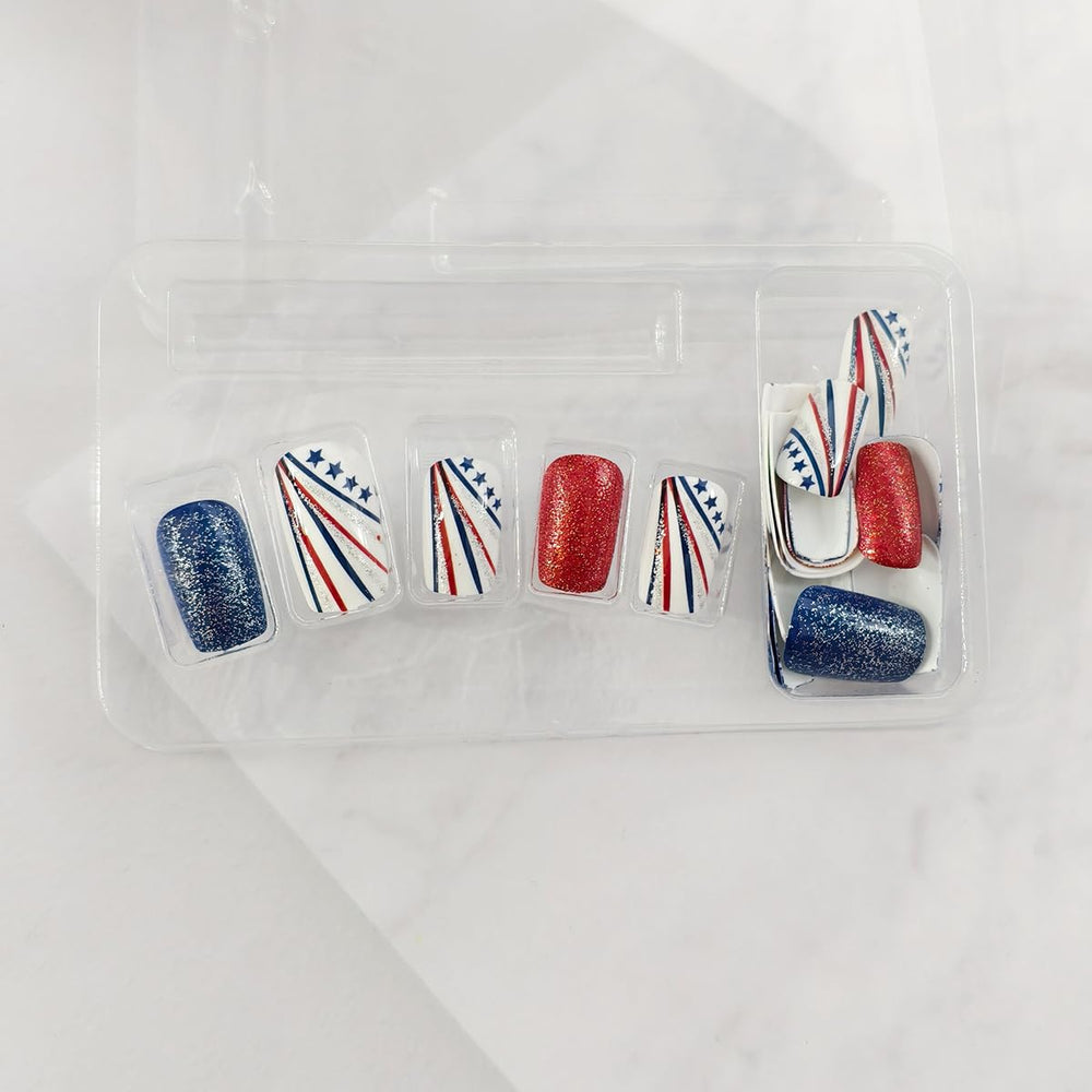 OSTTMA nails worn on hand in patriotic outfit showing instant style