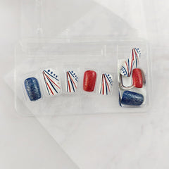 OSTTMA nails worn on hand in patriotic outfit showing instant style