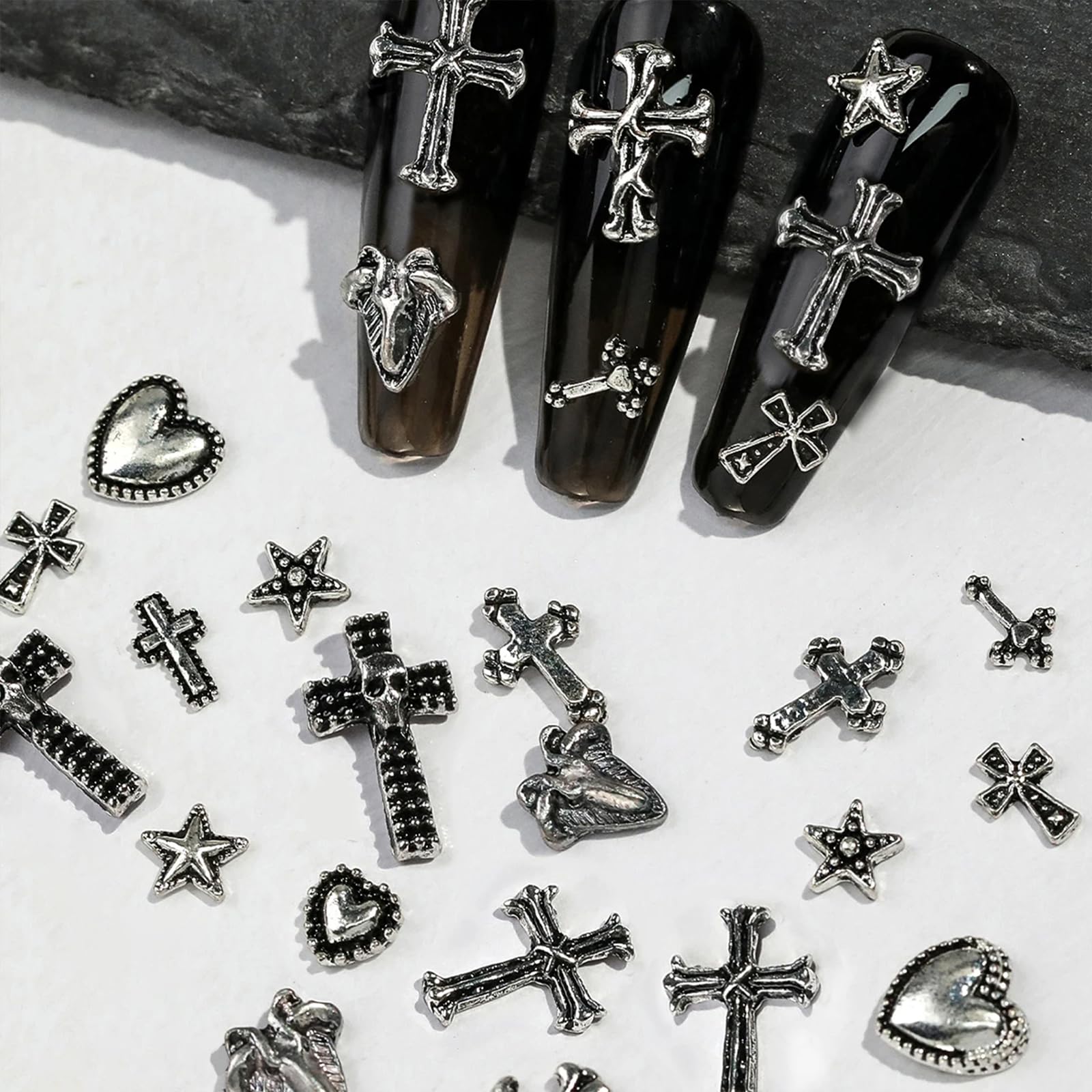 OTKARXUS charm on a natural nail showing discreet gothic accent and wearable style