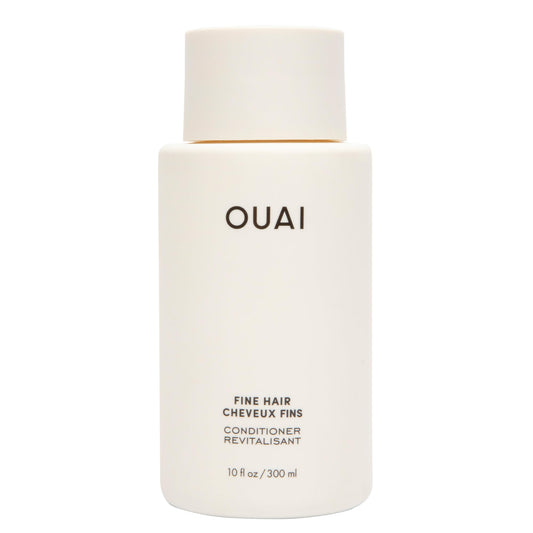 OUAI bottle front view showing branding and lightweight volumizing benefit