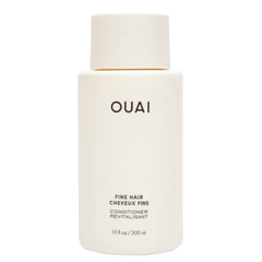 OUAI bottle front view showing branding and lightweight volumizing benefit