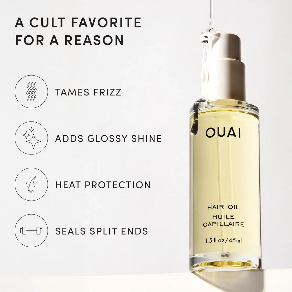 OUAI hair oil dropper dispensing a few drops for precise use