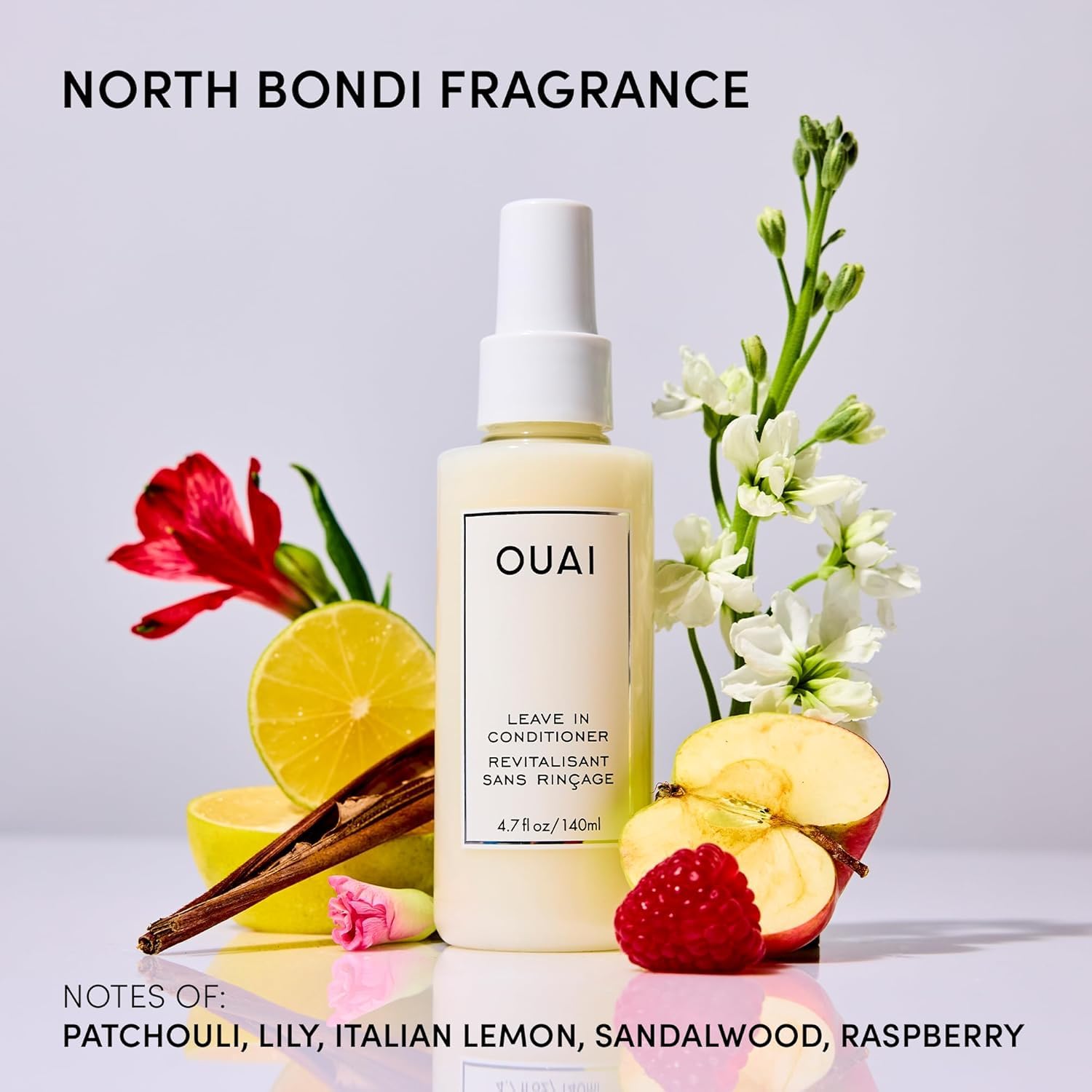 OUAI duo next to a passport and earbuds to show travel-size scale and portability benefits