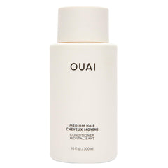 OUAI medium conditioner front bottle view showing clean design and size benefit