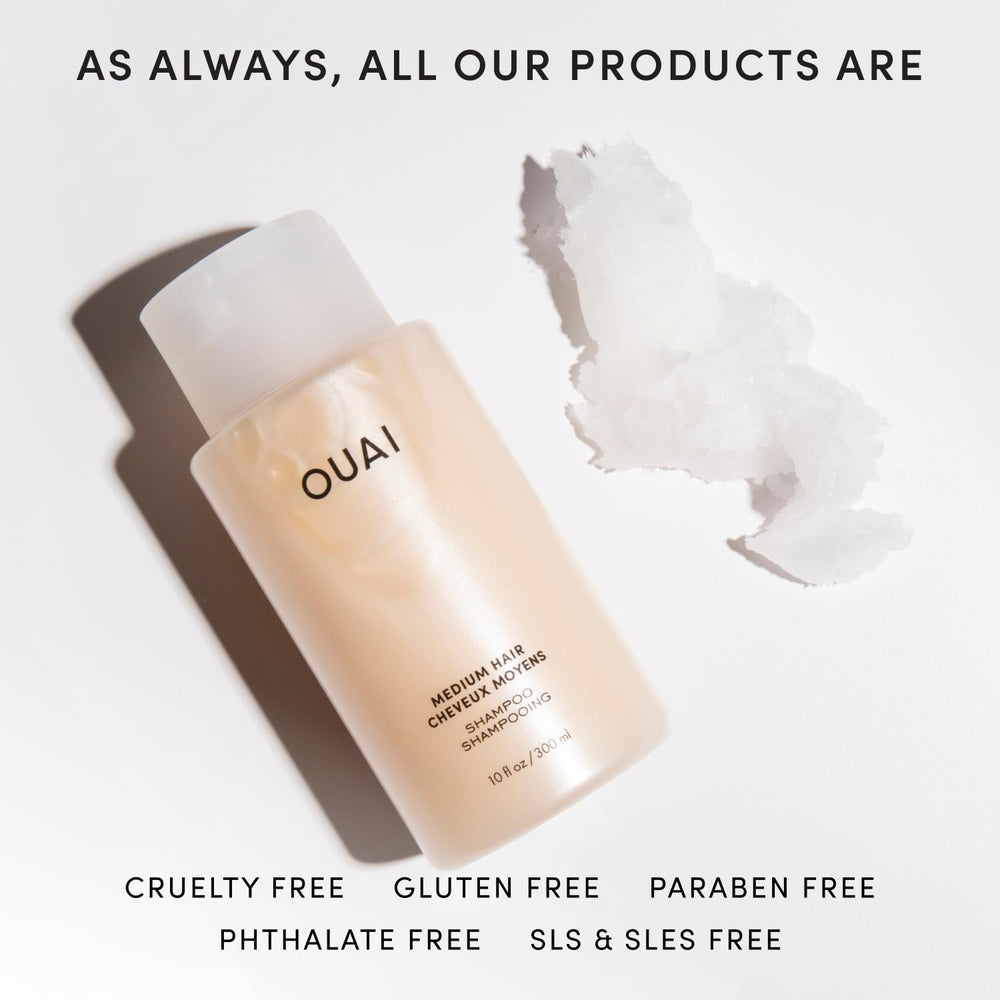 OUAI medium bottle held in hand showing large 32 oz scale and value