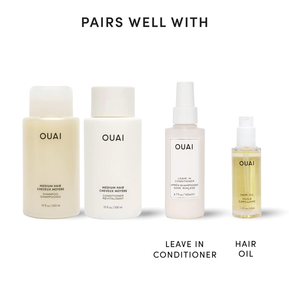 OUAI 10 fl oz bottles next to ruler showing travel-friendly size benefit