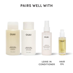 OUAI 10 fl oz bottles next to ruler showing travel-friendly size benefit