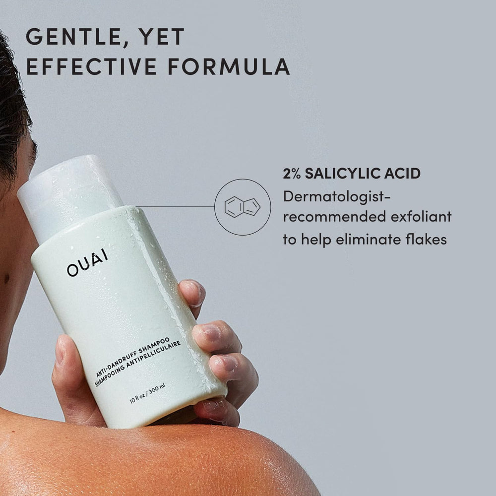 OUAI 10 fl oz bottle next to common items for size comparison and portability