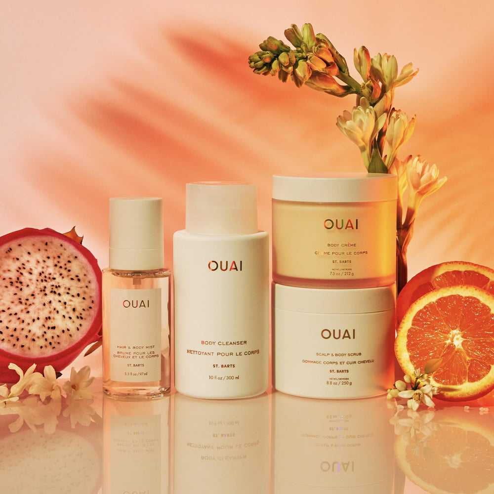 OUAI products tucked in a beach bag evoking tropical scent and vacation-ready benefit