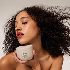 OUAI label detail photograph highlighting ingredient callouts and clean formula
