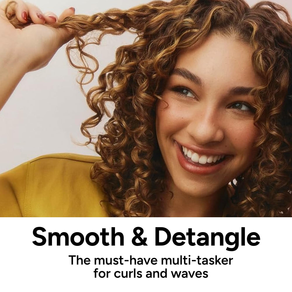 Ouidad creamy texture on palm demonstrating hydrating, detangling feel