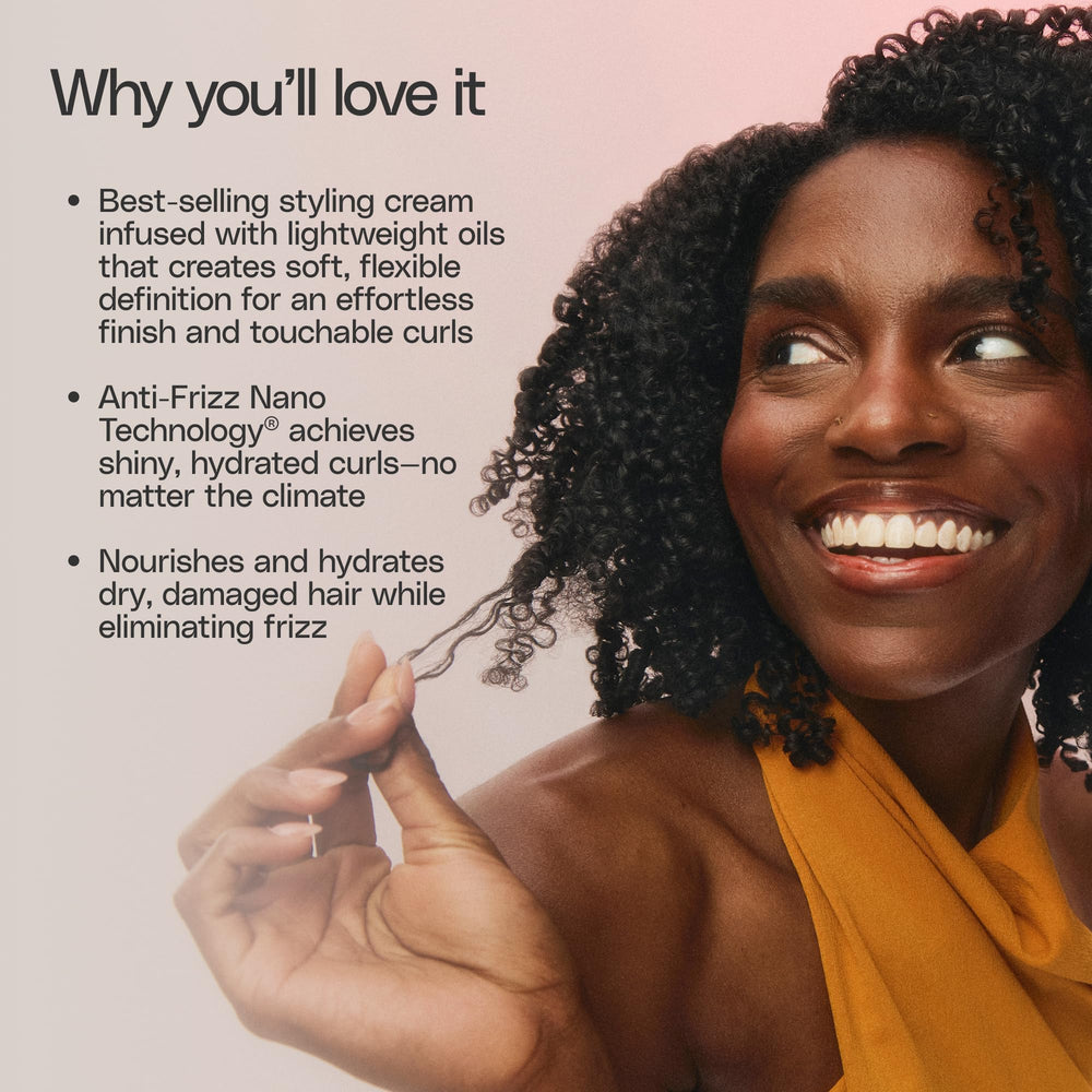 Ouidad hair being diffused in a salon-like setting showing enhanced curl definition benefit