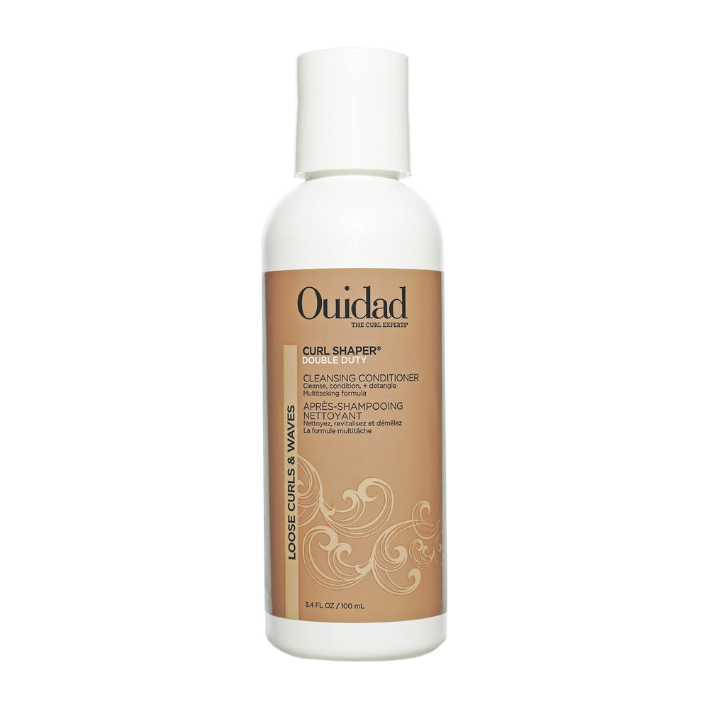 Ouidad travel bottle front view showing compact size and brand