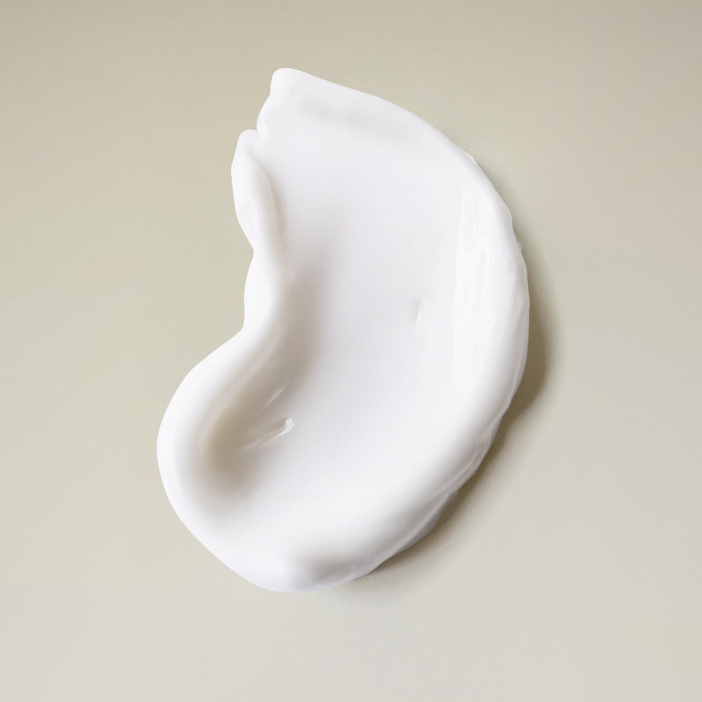 Ouidad shampoo texture close-up demonstrating creamy lather and hydration