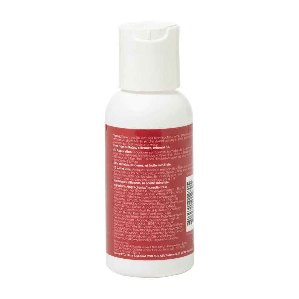 Ouidad travel gel next to hand showing 2.5 fl oz scale and travel convenience