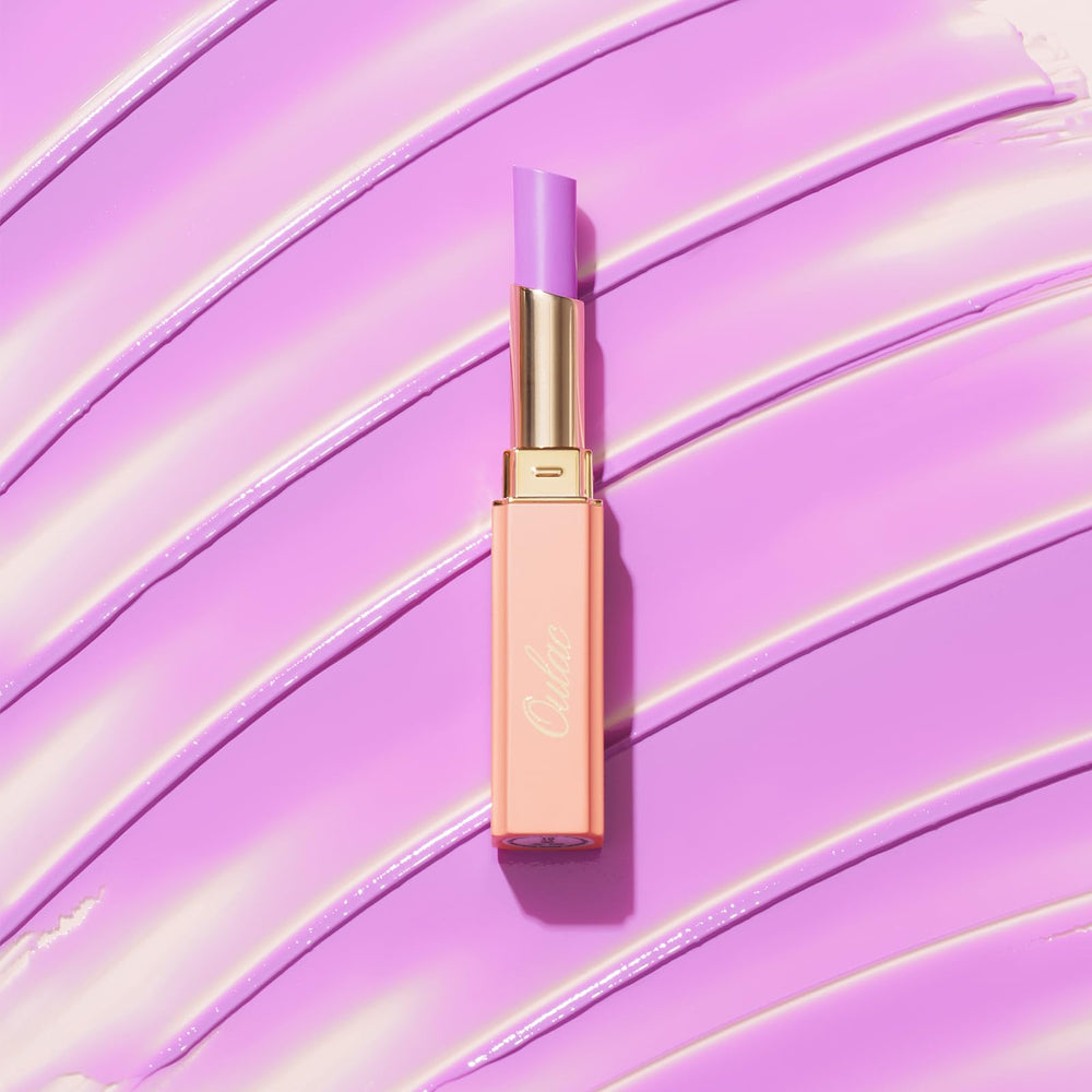 Oulac on model lips demonstrating juicy lilac color and flattering finish benefit