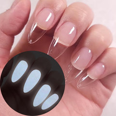 Oumisaya on styled nails in low light showing subtle glow for evening looks benefit