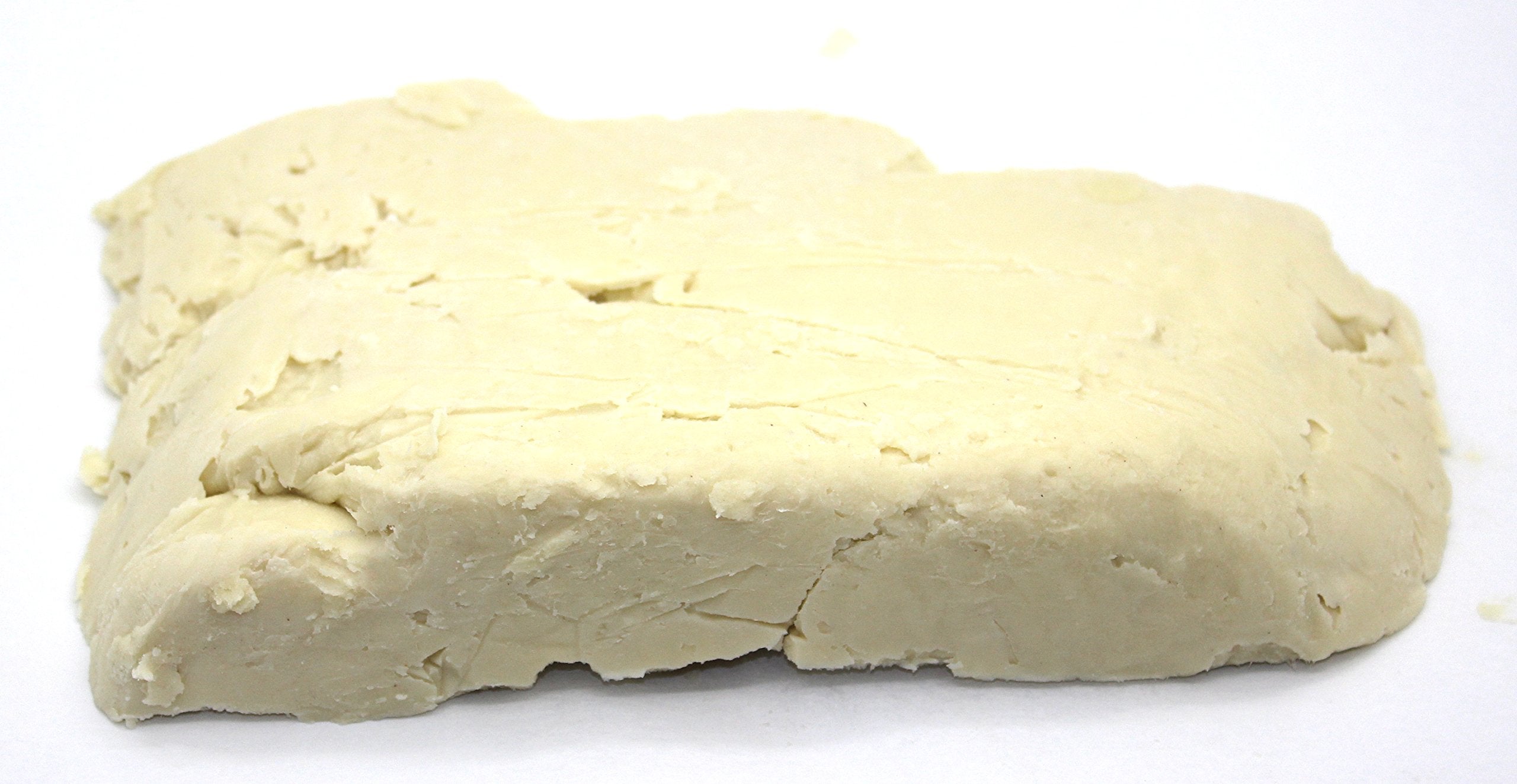 Our Earth's Secrets melted shea butter being mixed into salve, shows formulation ease