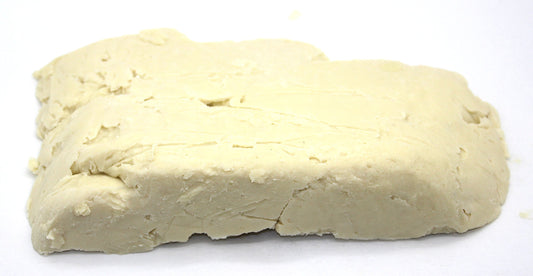 Our Earth's Secrets close-up of shea butter texture revealing creamy granules for smooth blending
