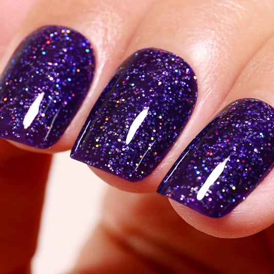 ozzeal front bottle displaying deep purple iridescent glitter and easy application benefit