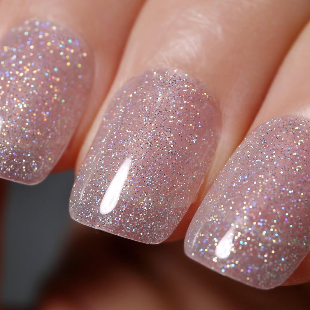 ozzeal front bottle clear silver glitter showing shimmer and easy application