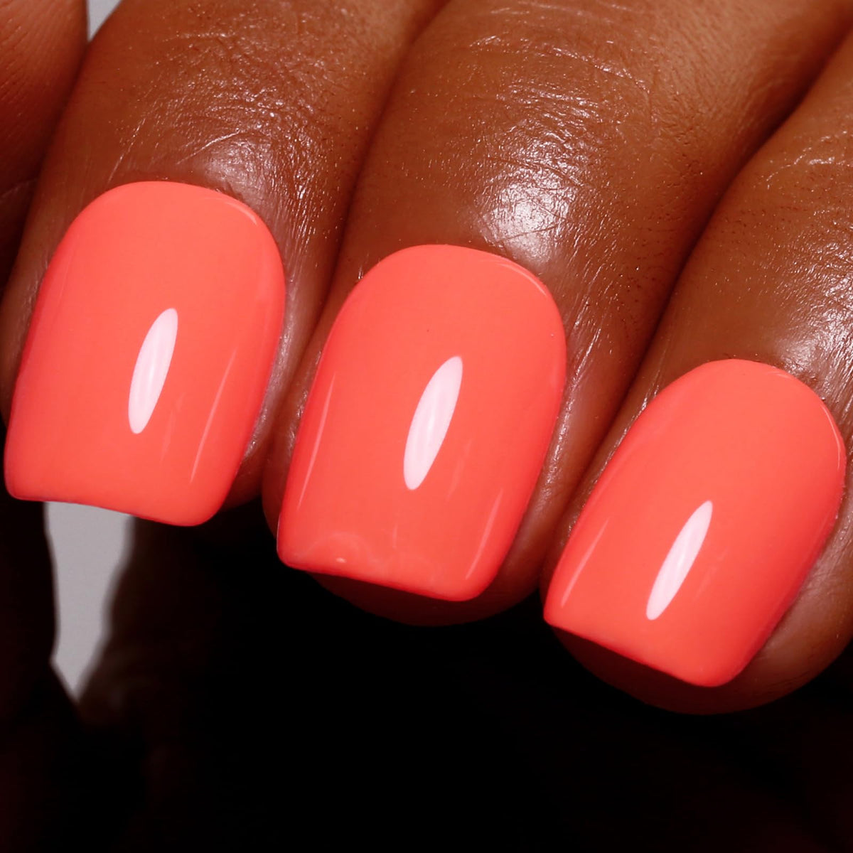 Ozzeal front bottle label showing bright coral orange shade and clear branding benefit