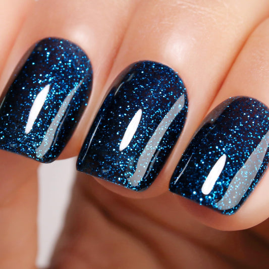 Ozzeal front label showing dark navy glitter polish and clear branding benefit: obvious color choice