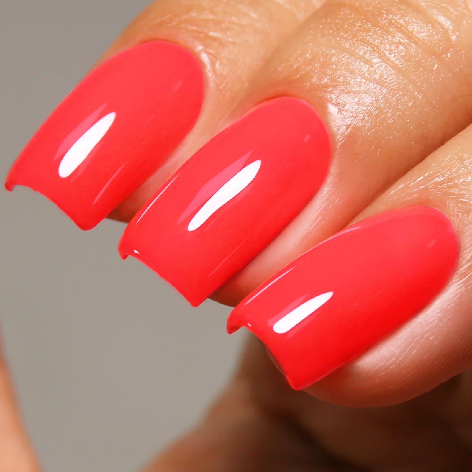 Ozzeal front bottle showing neon strawberry red for vibrant manicures