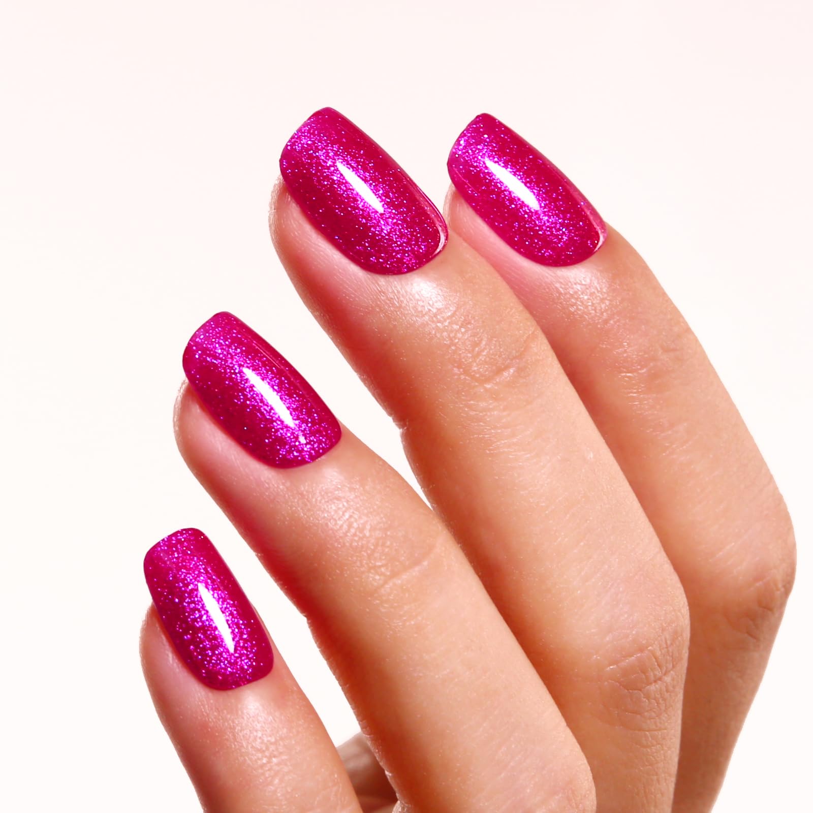 Ozzeal swatches on hand showcasing pearlescent glitter and salon finish
