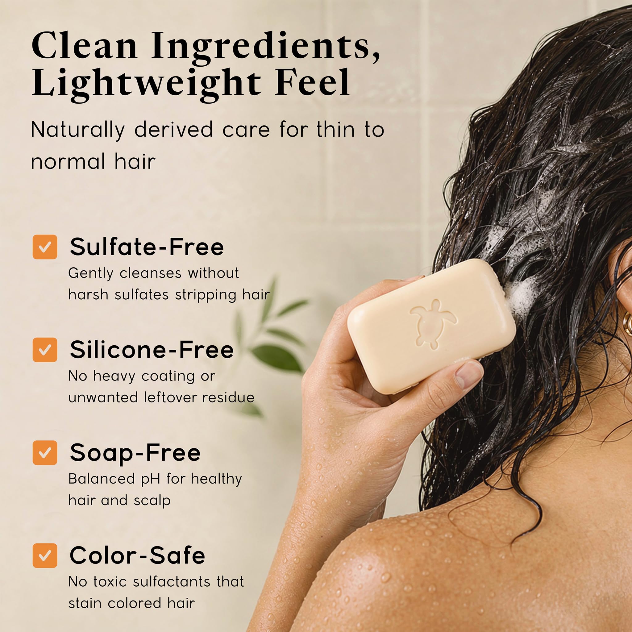 Pacific Spirit shampoo bar in hand applying to wet hair showing easy application benefit