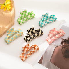Paderison checkered clips securing thick curly hair with reliable grip
