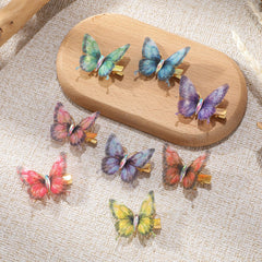Paderison butterfly clips worn with party outfit for whimsical accent