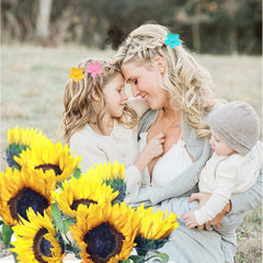 Palksky child wearing a flower clip for comfortable, cute everyday styling benefit