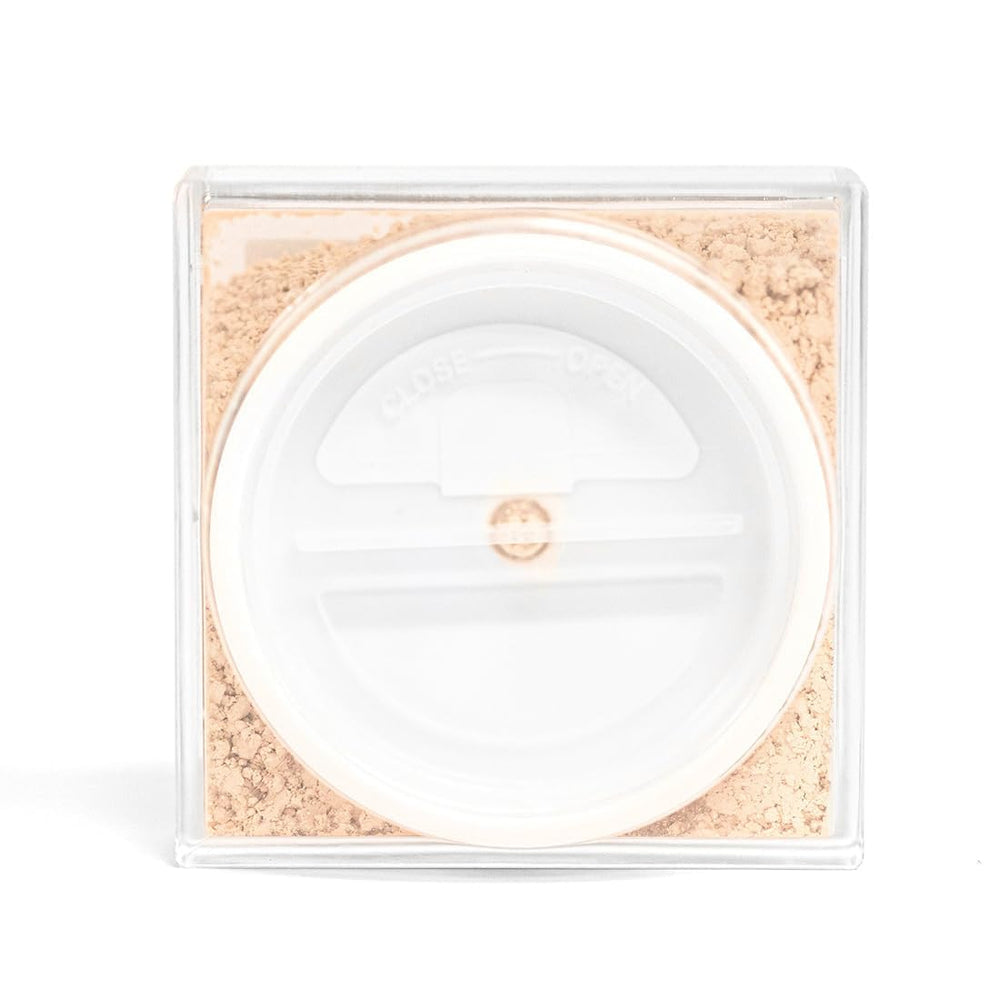 Palladio being applied with brush to set makeup for longer wear
