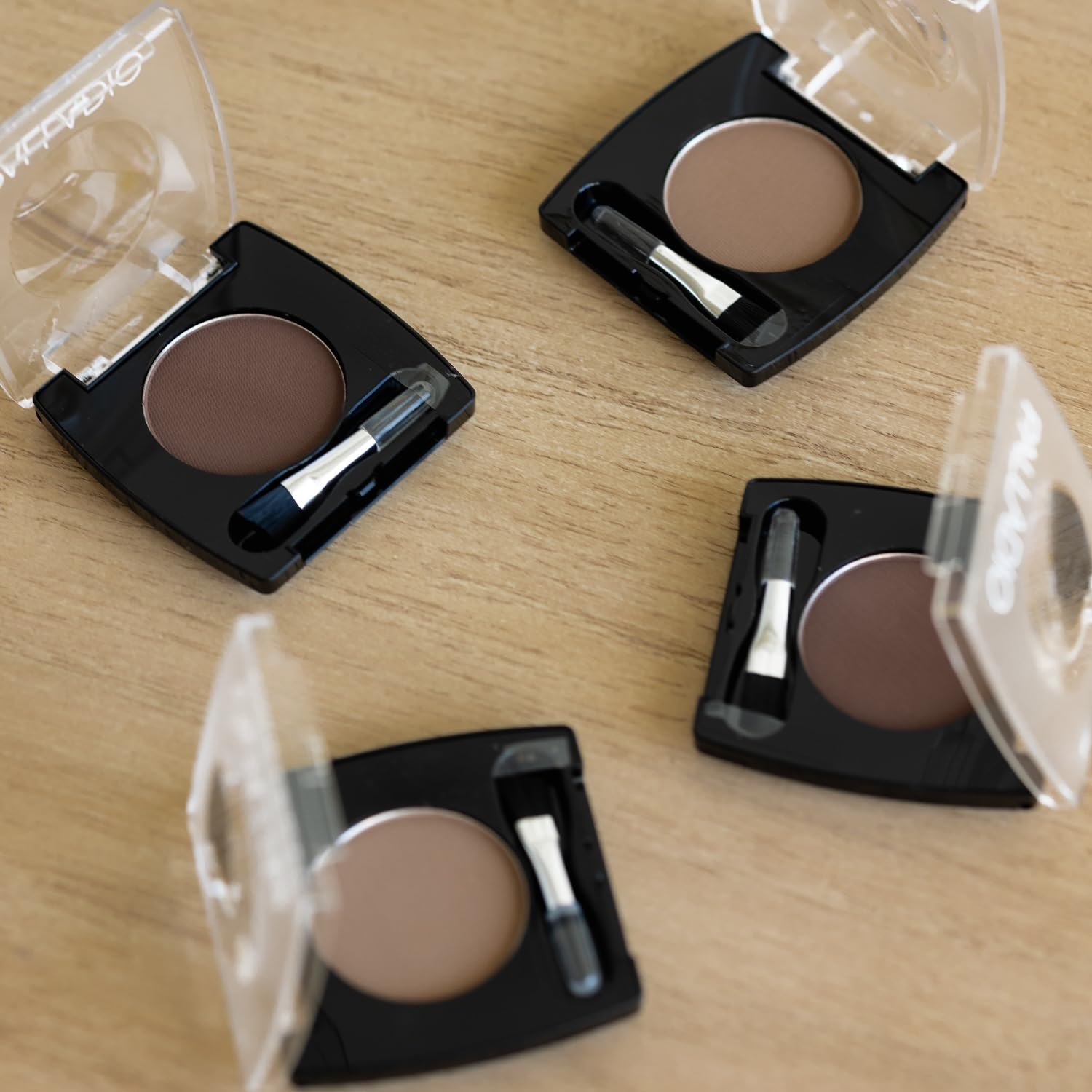 Palladio auburn shade swatched on skin showing natural, warm definition