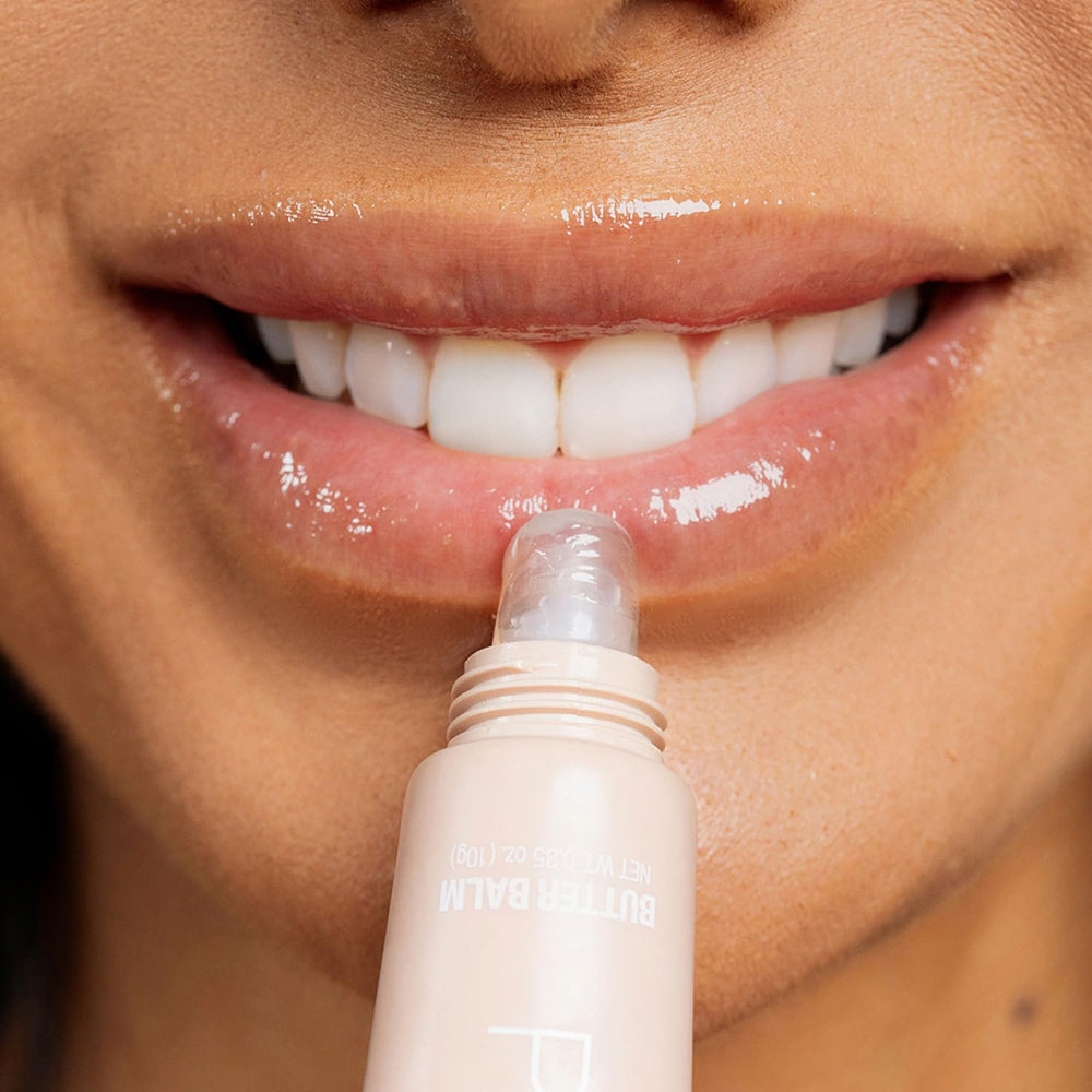 Palladio in hand for scale showing compact, portable lip balm