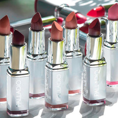 Palladio lipstick bullet extended to reveal creamy golden-orange tip for smooth application