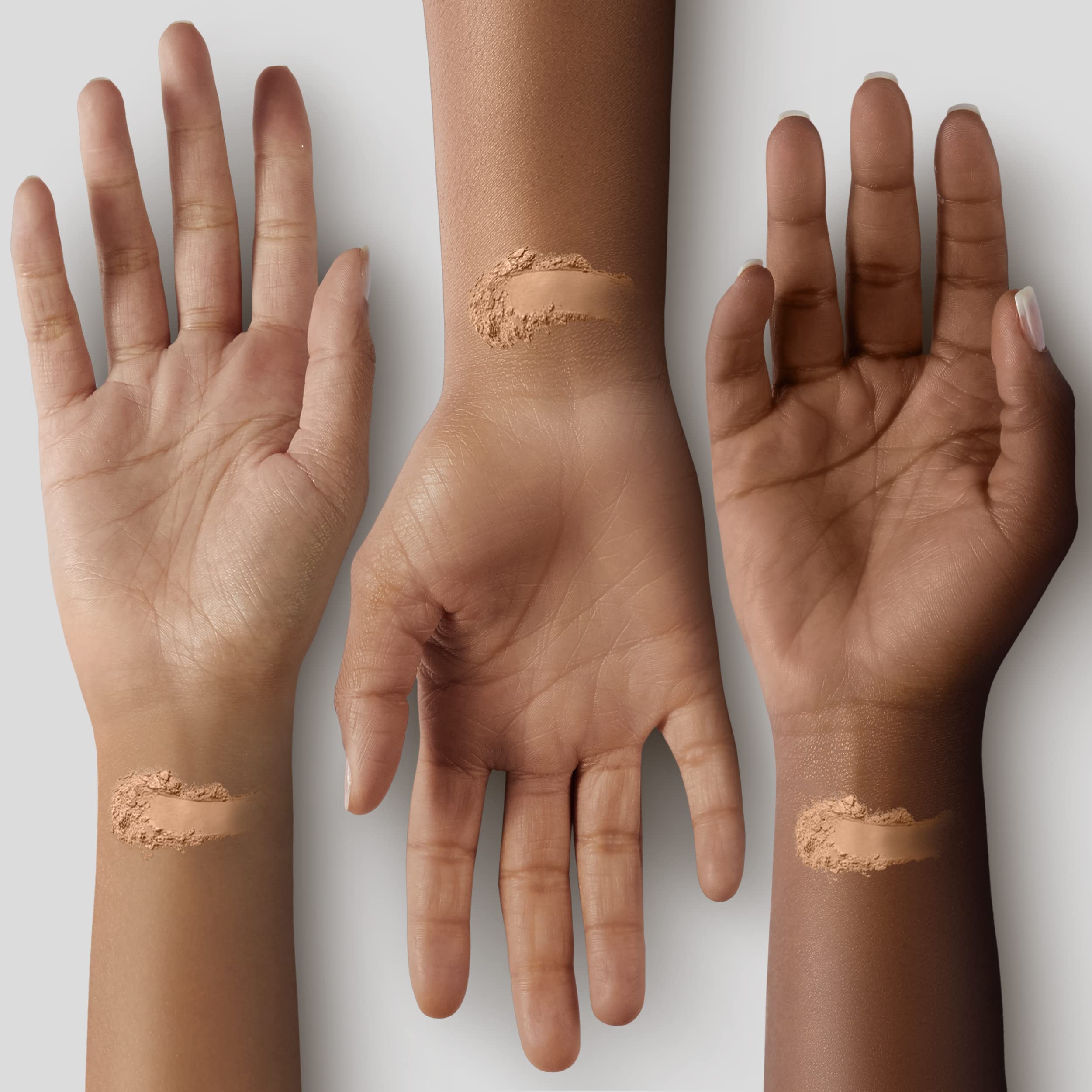 Palladio loose powder swatched on skin showing shear blendability and matte effect