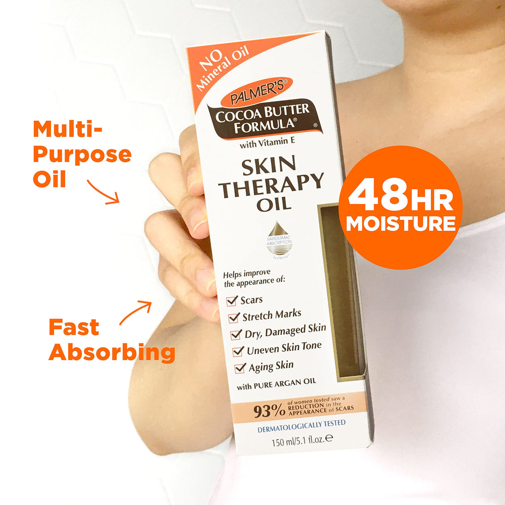 Palmer's oil being smoothed onto arm for softer, smoother skin