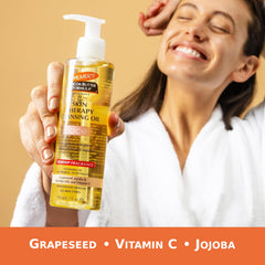 Palmer's pump dispensing cleansing oil into hand, demonstrates easy one-handed use