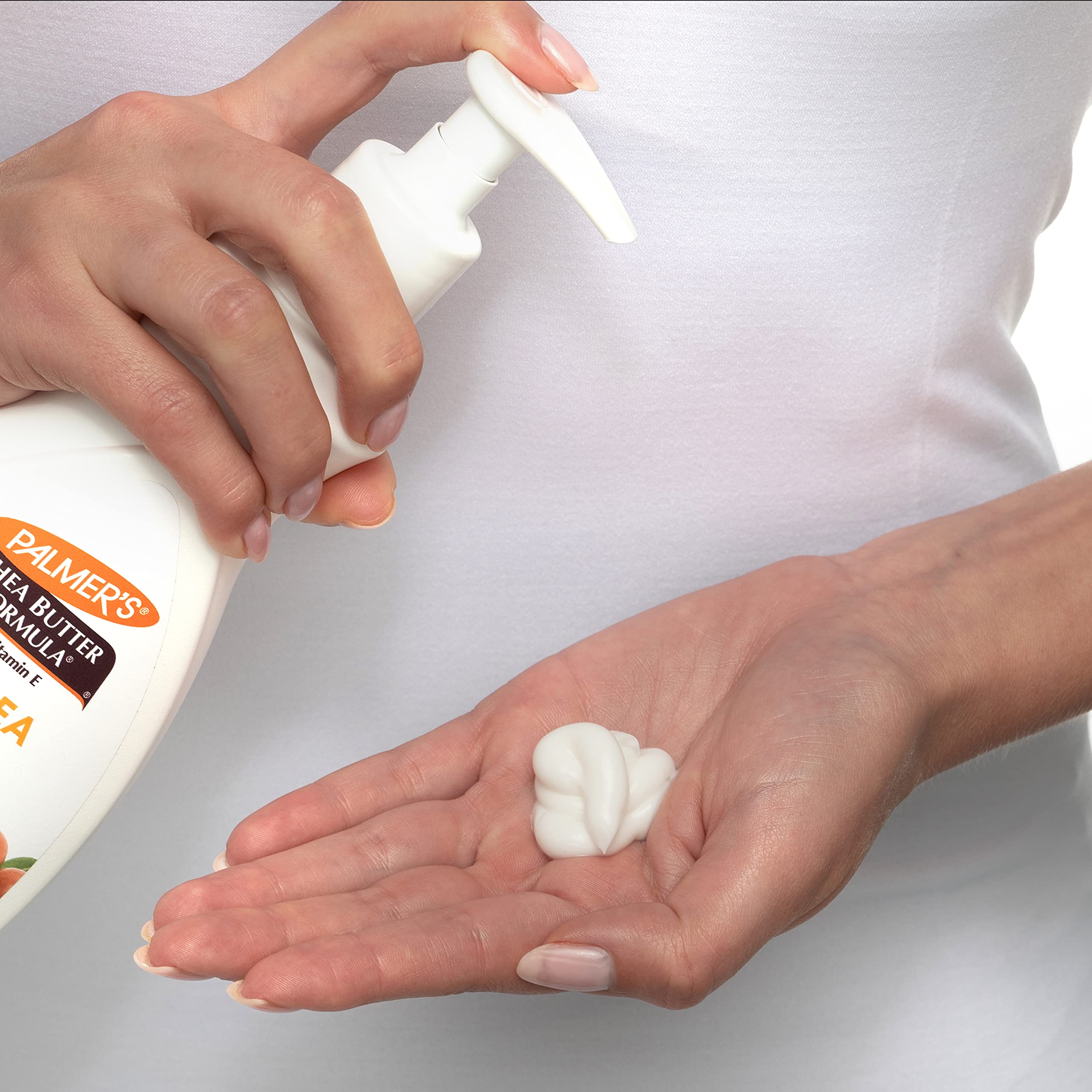Palmer's pump dispensing lotion onto hand for convenient, mess-free use