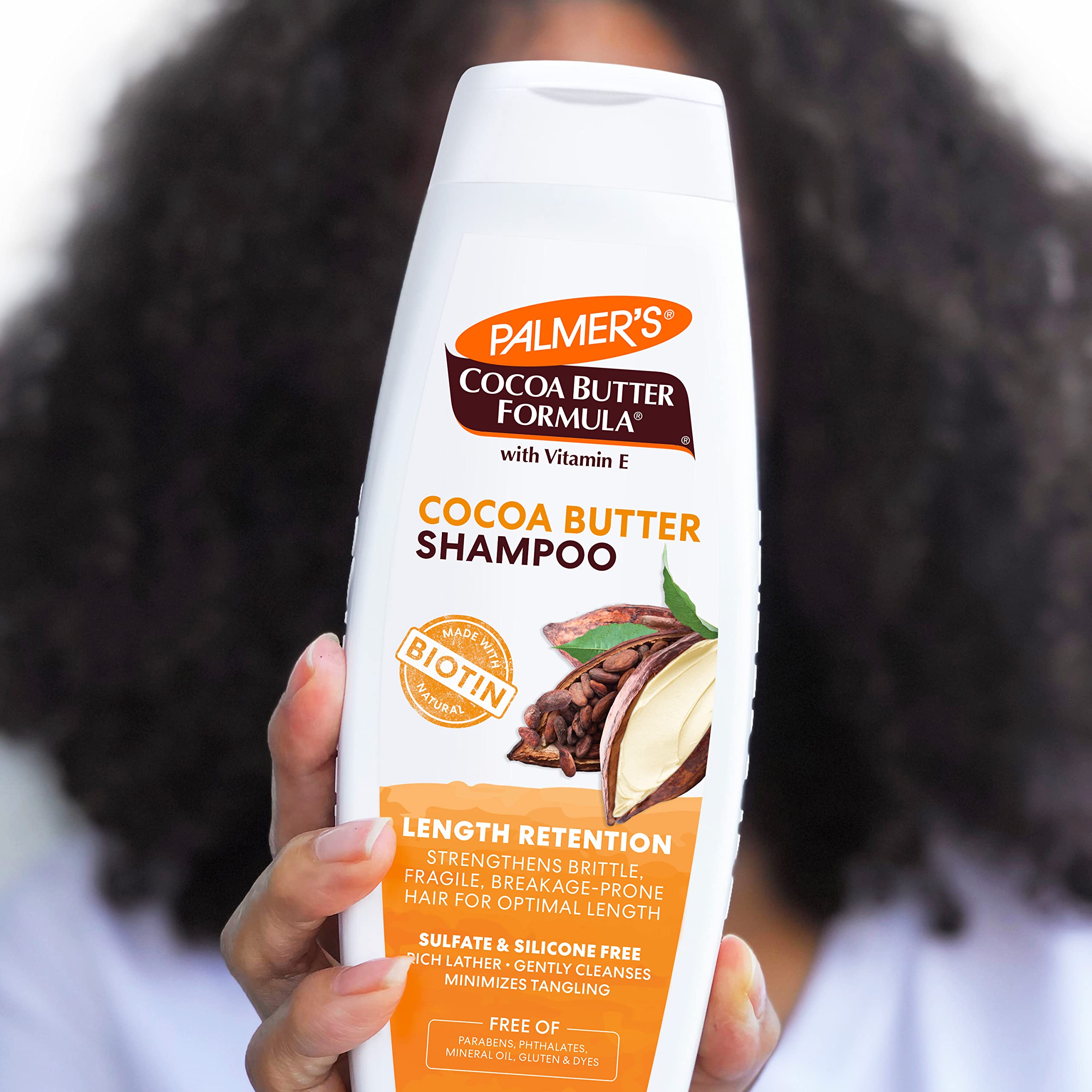 Palmer's shampoo pouring into palm for measured application