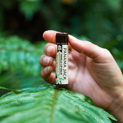 Panama Jack lip balm being applied to lips providing sun protection and soothing