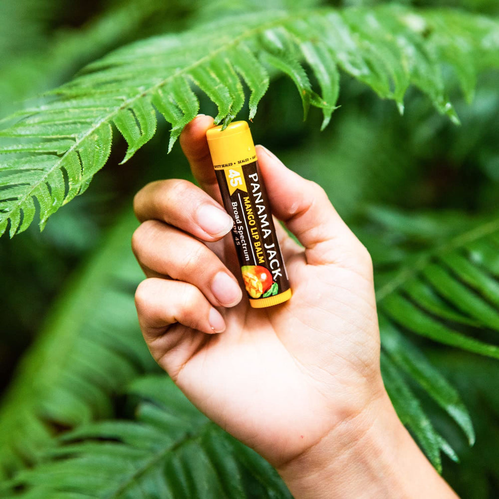 Panama Jack Tropical balm on a beach towel showing sun-ready protection