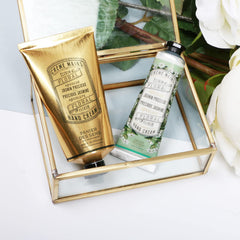 Panier des Sens cream beside a wallet illustrating small 1 fl oz portability